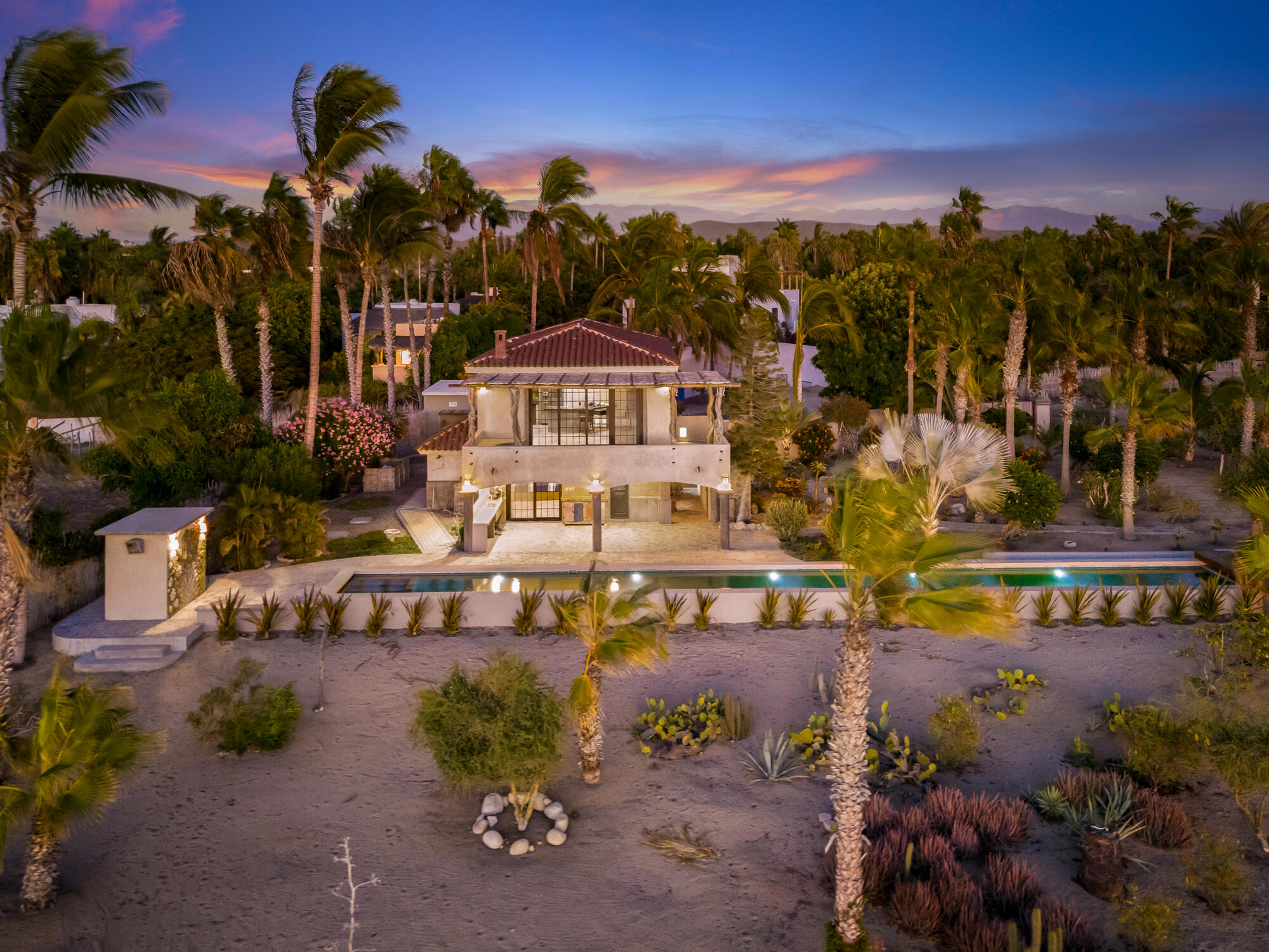 Club Campestre El Sargento A space you'll instantly fall in love with--Casa Amor is a striking Moroccan-inspired architectural retreat designed as a private, resort-style experience. Now offered at an exceptional value. This is not a conventional home, but a bold, multi-level, open-concept villa with soaring ceilings, dramatic arches, accordion glass walls, expansive terraces, and a resort-style pool patio, open air design stepping out to the heated lap pool. Flexible four-level layout with two living areas and two kitchens supports a couple, extended family, or duplex-style. Sleeps 2-10 with gym, garage, owner lock-off, storage, and three glamping tents. Direct access to trails above Rasta Beach, minutes to town. Established, proven rental income with professional marketing team in place. Priced to sell! – Beach Road Todos Santos, Pacific, BS