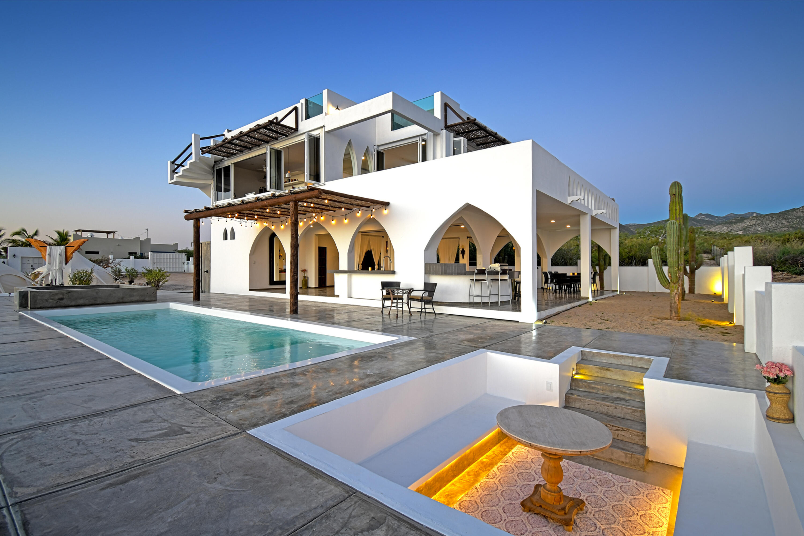 Club Campestre El Sargento A space you'll instantly fall in love with--Casa Amor is a striking Moroccan-inspired architectural retreat designed as a private, resort-style experience. Now offered at an exceptional value. This is not a conventional home, but a bold, multi-level, open-concept villa with soaring ceilings, dramatic arches, accordion glass walls, expansive terraces, and a resort-style pool patio, open air design stepping out to the heated lap pool. Flexible four-level layout with two living areas and two kitchens supports a couple, extended family, or duplex-style. Sleeps 2-10 with gym, garage, owner lock-off, storage, and three glamping tents. Direct access to trails above Rasta Beach, minutes to town. Established, proven rental income with professional marketing team in place. Priced to sell! – Calle Caracol, La Paz, BS