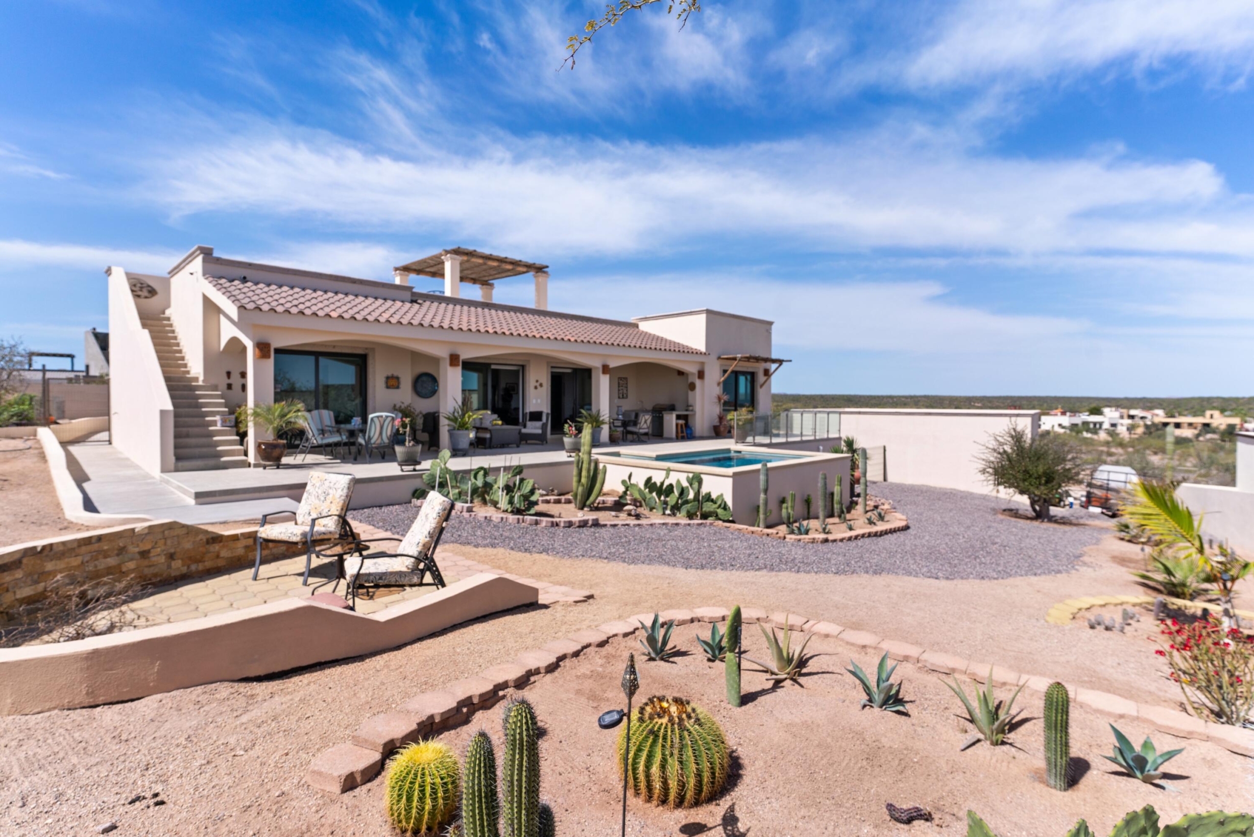 Club Campestre La Ventana GET TWO LOTS with this COMBINATION! Ideal for families, GROUPS, INVESTORS seeking rental or BUSINESS OPPORTUNITY! Sustainable construction Commune of Rammed Earth Homes has FOUR PRIVATE SUITES, two of which have kitchens, within two independent rammed earth homes. Enjoy shared amenities like SWIMMING POOL and fire pit area for outdoor enjoyment.Each unit features private entrances and quiet, comfortable interiors with kitchens and ensuite bathrooms. Rooftop terraces offer ocean – El Sargento, La Paz, BS