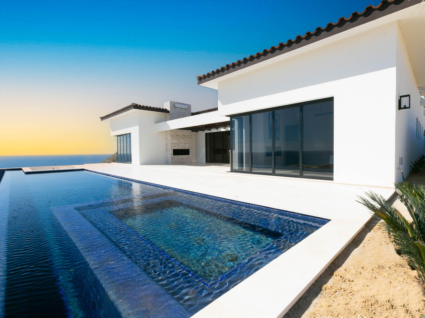Club Campestre Copala Lot 40 is a stunning two-story residence featuring dual primary suites on the upper level, offering expansive Pacific Ocean for sale