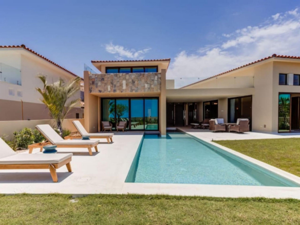 Club Campestre Vista Lagos Stunning fully furnished 3BR villa + service room (considered as the 4th bedroom) in exclusive Club Campestre. Enjoy a heated pool, jacuzzi, and stylish outdoor areas. The primary suite features a private terrace, jacuzzi, spa space, and walk-in closet. Two guest bedrooms with ensuite baths and a versatile service room add comfort. Open-concept kitchen, dining for 8, fire pit, and grill make it ideal for entertaining. Lot size: 9,972 sq ft. Just 15 min from downtown San José del Cabo, near golf, beaches, top restaurants, shopping, hospitals, and schools. Gated community with 24/7 security. Located within the prestigious gates of Club Campestre, Vista Lago 26 is more than a homeit's a refined expression of Los Cabos living. With nearly 10,000 sq ft of land, this villa offers generous space, architectural elegance, and a seamless indoor-outdoor flow designed for both quiet moments and memorable gatherings.This home stands out not only for its layout and finishes but for the ease of living it offers. From the heated pool and private jacuzzi to the fully equipped kitchen and fire pit lounge, every detail was conceived to elevate comfort and connection. Whether hosting family, friends, or guests, the design allows everyone to enjoy privacy and togetherness in equal measure.Beyond the walls of the home, Club Campestre itself becomes an extension of your lifestyle. The community is known for its discreet luxury, sense of calm, and exceptional amenities: an 18-hole Jack Nicklaus Signature golf course, private beach club (optional membership), and a strong sense of neighborhood securitythanks to 24/7 controlled access.But what truly sets this location apart is proximity. In just a few minutes, you can access:The golden sands of Palmilla, Costa Azul and Cabo Surf (ideal for swimming or surfing)Upper Scale supermarkets (La Comer, Chedraui Selecto)Leading hospitals and bilingual private schoolsDowntown San José del Cabo, full of culture, art, and historic charmIf you're an investor, the home's potential as a luxury short-term rental is immediate. The combination of size, amenities, location, and style make it highly attractive to discerning travelers looking for private, secure accommodations with resort-level experiences. If you're a full-time resident or digital nomad, you'll appreciate the stable infrastructure, fiber optic internet, nearby medical support, and ease of access to both San José and Cabo San Lucas via the Transpeninsular Highway (just 100 meters away).The home has also been carefully maintained, is sold fully furnished, and includes modern appliances and home systemsmaking your transition seamless from day one.In summary: Vista Lago 26 is turnkey luxury with long-term value. Whether you're looking to invest, relocate, or upgrade your lifestyle, this home delivers Cabo's promise of sun, space, and soulbeautifully. – Lote 26 Vista Lago, San Jose del Cabo, BS