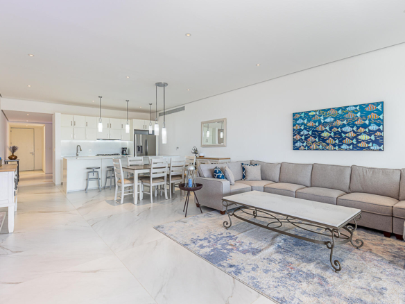 Club Campestre Cora One of the lowest-priced furnished residences currently available in Cora, this 2024-built condo is move-in ready and located within Club Campestre in San José del Cabo. The floor plan offers 3 bedrooms and 3.5 baths with approximately 1,841 sq ft of interior living space. Bright, modern interiors feature large-format tile flooring, an open-concept kitchen with island seating, and expansive sliding glass doors that connect seamlessly to oversized private decks. The interior design emphasizes clean lines, neutral finishes, and a cohesive open layout that connects the kitchen, dining, and living areas into a single, light-filled space. The kitchen is centered around a large island with quartz-style surfaces, modern cabinetry, and pendant lighting, opening directly to the main living area for easy entertaining. Floor-to-ceiling sliding glass doors extend the living space outdoors, creating a strong indoor-outdoor connection and allowing natural light to flow throughout the residence.Living and dining areas are furnished with contemporary pieces scaled appropriately for the space, complementing the modern architectural style seen throughout the development. Bedrooms are well-proportioned and designed for privacy, while bathrooms feature glass-enclosed showers and streamlined finishes consistent with the home's overall aesthetic. Privacy blinds, LED televisions with integrated switching, and thoughtfully placed lighting add functionality while maintaining a clean visual profile.Outdoor living areas are a standout feature, with expansive decks and patios offering generous space for seating, dining, and relaxation while overlooking the community's architectural landscaping and surrounding natural terrain.. Two covered on-property parking spaces include electricity and water connections suitable for electric vehicle charging or vehicle washing, and a private 10x10x14 storage locker with electricity provides secure owner storage.Cora is a gated, master-planned community within Campestre San José, featuring contemporary architecture and resort-style amenities visible throughout the property. Community offerings include a large swimming pool with integrated lounging areas, a hot tub, fitness center, indoor children's play area, and an enclosed dog park, all supported by 24/7 security. The Campestre San José golf course is approximately 0.5 miles away, and the private beach club on the Sea of Cortez is roughly 2.5 miles from the residence, subject to membership terms.Dining, recreation, and services are easily accessible, with Flora Farms approximately 2.8 miles away, Acre Restaurant about 3.0 miles, and the Historic Art District of downtown San José del Cabo roughly 4.5 miles from the property. Beachfront dining along the Tourist Corridor, including venues such as Veleros Beach Club and 7 Seas Grille & Seafood, is approximately 6.5 miles away, while Los Cabos International Airport is about 10.5 miles from the residence.Offered fully furnished and... – Cora Sunrise, San Jose del Cabo, San Jose del Cabo, Baja California Sur BS